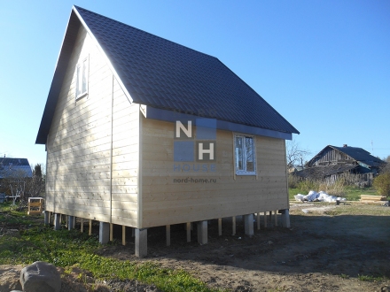 Каркасный дом с фасадом из имитации бруса